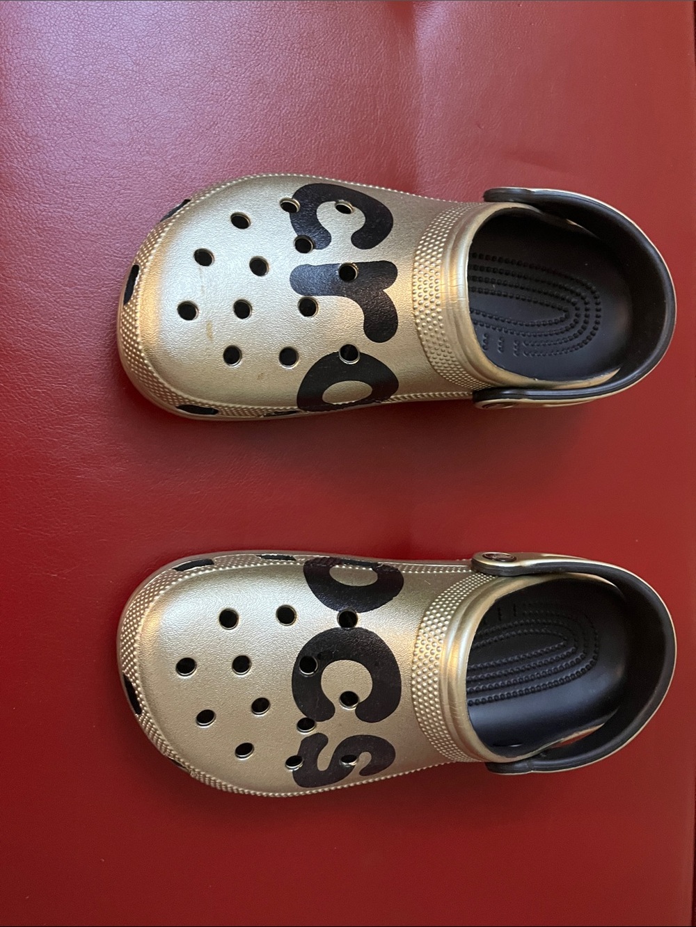 CROCS Gold Metallic Slip-On Sandals with Black Logo